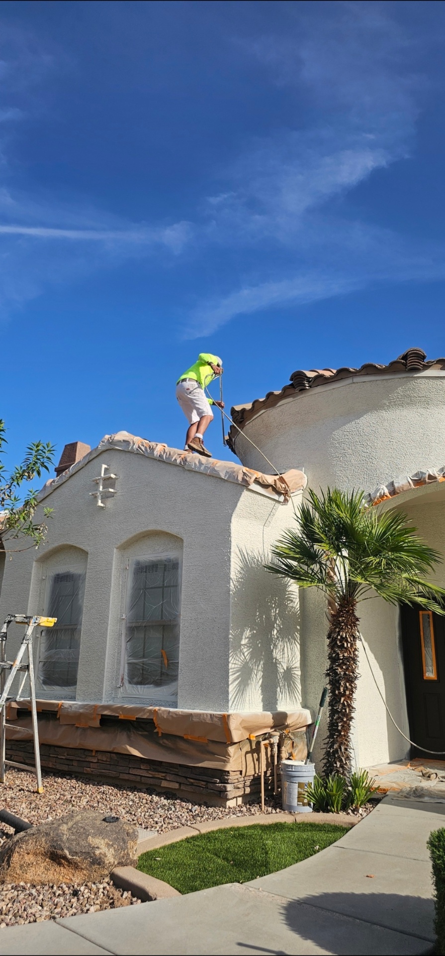 Legacy Premier Painting crew painting a luxury home exterior