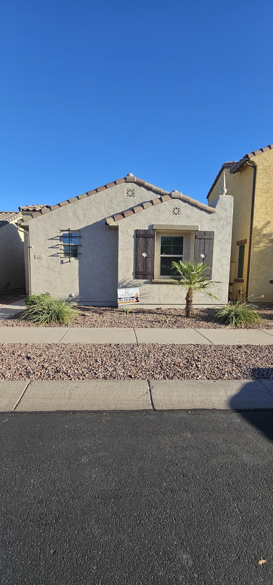 Painted single-story Arizona home front